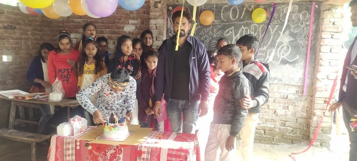 Volunteers and children together